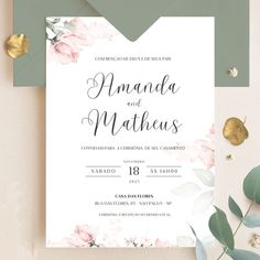 an elegant wedding card with pink flowers and greenery