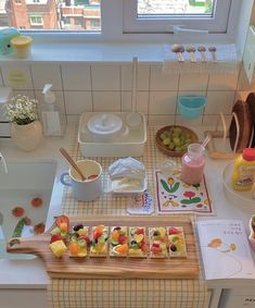 a kitchen counter topped with lots of food