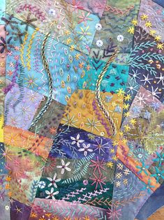 a close up of a colorful quilt on a table