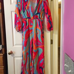 Fun Colorful Jumpsuit For Date Night Brunch Lunch Any Occasion Long Sleeve Printed Jumpsuits And Rompers For Beach, Long Sleeve Printed Jumpsuits For Beach, Long Sleeve Printed Jumpsuits For The Beach, Trendy Long Sleeve Jumpsuits And Rompers For Beach, Pink Beachwear Jumpsuits And Rompers For Vacation, Pink Printed Jumpsuits And Rompers For Party, Multicolor Long Sleeve Jumpsuits And Rompers For Loungewear, Pink One-piece Jumpsuit For Vacation, One-piece Pink Jumpsuit For Vacation