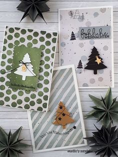 three christmas cards with different designs on them