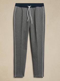 Athletic with a twist, this scuba-knit track pant is made from a sumptuously soft cotton blend with notable houndstooth — the perfect fusion of old-school style and modern athleisure.  TAPERED FIT: Mid rise.  Relaxed fit with a tapered leg.  Flat k Athleisure Joggers For Workwear In Fall, Fall Athleisure Joggers For Workwear, Fall Athleisure Sweatpants For Casual Wear, Athleisure Bottoms With Contrast Trim For Loungewear, Stretch Joggers For Workwear In Fall, Sporty Fitted Joggers For Work, Sporty Pants With Ribbed Cuffs For Work, Stretch Sweatpants With Side Stripes For Loungewear, Sporty Spring Sweatpants