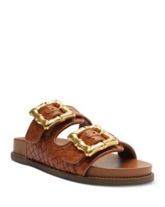 Schutz Women's Enola Slip On Buckled Slide Sandals Designer Open Toe Sandals With Gold Buckle, Designer Leather Sandals With Gold Buckle, Designer Brown Sandals With Tang Buckle, Luxury Leather Sandals With Gold Buckle, Brown Leather Sandals With Gold Buckle, Designer Brown Sandals With Buckle Closure, Brown Open Toe Sandals With Gold Buckle, Luxury Sandals With Gold-tone Hardware And Round Toe, Luxury Sandals With Buckle Closure For Vacation