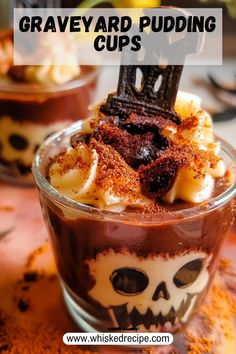 a cup filled with pudding and topped with whipped cream, chocolate sprinkled on top