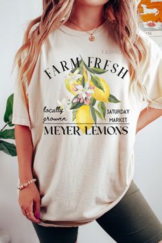 Dive into summer with farm-fresh meyer lemons, indulge in the softness of a Comfort Colors t-shirt. Whether paired with shorts for a beach day or dressed up with a skirt for a sunset soirée, this summer staple exudes both comfort and farmcore flair. 𝔻𝔼𝕋𝔸𝕀𝕃𝕊 Comfort Colors 1717 T-Shirt 💗Fabric content: 100% Cotton 💗Feel: luxe thick garment-dyed cotton 💗Fit: oversized unisex fit - Models are wearing XL Gildan 5000 T-Shirt 💗Fabric content: 100% Cotton; heathered colors have added polyest Farmers Market Shirt, Lemon Shirt, Support Local Farmers, Fruit Stand, Fresh Shop, Fit Models, Local Farmers Market, Fresh Market, Meyer Lemon