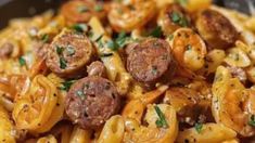 pasta with sausage and onions in a skillet