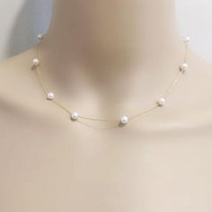 Item No: NK584Item:sterling silver pearl necklacePearl shape:round shapePearl size:5-6mmPearl color: whitePearl skin: with little flawsPearl luster: goodPearl quality: AAthe space between two pearl: 3.5cmChain length: 16inch,18inch,20inch,22inch,24inch,26inch,27.5inchChain: sterling silver with white gold plated, or yellow gold platedPacking: beautiful giftbox, ready for gift givingPlease contact Lisha if any more questions. Gold Pearl Jewelry Necklace Classic, Spaced Out Pearl Necklace, Bride With Pearl Necklace, 5 Pearl Necklace, Pearl Bridal Necklace, Dainty Pearl Pendant Necklace For Party, Pearl Necklace Prom, Necklaces With Pearls, Dainty White Pearl Necklace For Anniversary