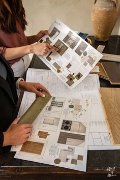 Interior designers looking at a custom build home moodboard and floor plans Vision Board For Interior Design, Visual Vision Board, Interior Design Career Vision Board, Interior Designer Mood Board, Interior Design School Projects, Interior Designer Vision Board, Drawing Vision Board, Interior Designer Office Studio, Architecture Vision Board