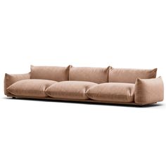 a beige couch sitting on top of a white floor