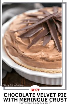 the best chocolate velvet pie with meringue crust in a white dish on a wooden table