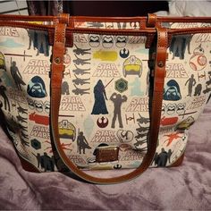 Euc Dooney Disney Star Wars Tote. Very Colorful Sturdy Tote. Pre Loved. Taken Well Care Of. Great Condition. Brown Disney Bags For Everyday Use, Disney Style Brown Bag For Everyday Use, Disney Everyday Brown Bags, Dooney And Bourke Disney, Round Bag, Ostrich Leather, Tote Bag Purse, Nylon Tote, Dooney & Bourke Bags