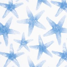 blue watercolor stars on white paper for wallpaper or fabric design, closeup