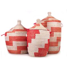 three red and white baskets sitting next to each other