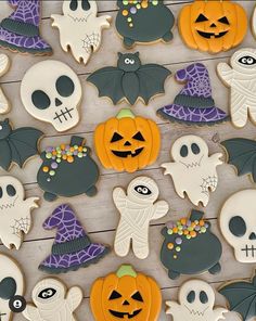 decorated halloween cookies on a wooden table