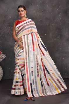 Buy beautiful off-white multicolor stripes applique linen sari online in USA. Keep your ethnic wardrobe up to date with latest designer sarees, pure silk sarees, handwoven sarees, tussar silk sarees, embroidered sarees from Pure Elegance Indian saree store in USA.-full view Patchwork Saree, Tussar Silk Sarees, Latest Designer Sarees, Linen Saree, Fashion Journals, Pure Elegance, Red Blouse, Tussar Silk Saree, Indian Saree