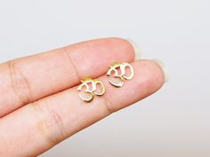 . ❤ONE PAIR of Ohm earrings // The gold color will be fade away to sterling silver over time . ❤ Size: 9.2 x 9.5 mm . ❤The post length: 11 mm . ❤ It will come in a gift box. . ❤ Material: 925 Sterling Silver (Solid) (It's completely natural for sterling silver to oxidize over time when it's exposed to air. After each wear, use the sterling polishing cloth to make them shine like new again and Please keep them in airtight plastic bags!) . ❤ Hypoallergenic Nickle free and Lead-free . ❤ Made in Thailand ---------------------------------------------------------- ---------------------------------------------------------- Please read it before making the order: (Update 2024) . ✦ Shipment: We ship the package from THAILAND by Thailand post and USPS (For only USA) . ✦ The order will be ship out wi Om Earrings, Namaste Yoga, Chakra Jewelry, Yoga Gifts, Plastic Bags, Jewelry Earrings Studs, Namaste, Plastic Bag, Chakra