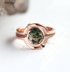 Alternative moss agate and diamond engagement ring set in rose gold. A stunning unique Saturn ring set, statement piece by MinimalVS. The prices listed are for the three ring set. We are the original jewelry designers to use moss agate and create geometric moss agate one of a kind jewelry. Please beware of other jewelry designers using moss agate as their designs are replicas of our bestsellers and cannot match our high standards of production and authentication of quality. All moss agates are n Saturn Ring, Planet Ring, Unique Engagement Ring Settings, Moss Agate Engagement Ring, Celestial Ring, Ring Rosegold, Agate Engagement Ring, Moss Agate Ring, Rutile Quartz