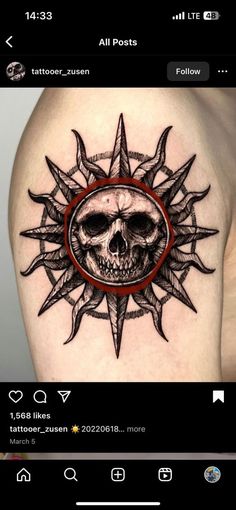 a tattoo with a skull and compass on it