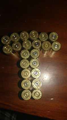 some very pretty gold buttons on a wooden table