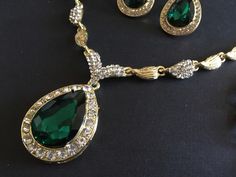 "** This necklace comes with a matching bracelet together with a pair of earrings (studs at back design). ** Featuring lovely teardrop shaped pendants embellished with clear rhinestones crystals and green glass stones on top. Great to wear on your wedding day or party event!! Color: gold plated with clear rhinestone crystals and green glass stones Size: necklace measures around 19\" long x center 2\" drop x 1\" width, bracelet 8.5\" long x 0.75\" width and earrings 1.35\" long x 0.75\" width ** Emerald Teardrop Pendant Necklace For Weddings, Emerald Pear-shaped Necklace For Wedding, Emerald Pear-shaped Wedding Necklaces, Elegant Green Rhinestone Jewelry Sets, Elegant Green Jewelry Sets With Rhinestones, Elegant Emerald Teardrop Pendant Necklace For Weddings, Pear-shaped Emerald Necklace For Wedding, Green Pear-shaped Emerald Necklace For Wedding, Emerald Drop Jewelry For Weddings