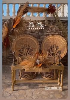 two wicker chairs sitting next to each other