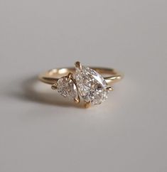 three stone engagement ring in yellow gold