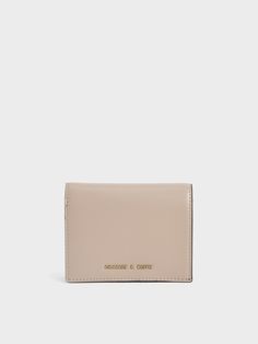 Carry just what you need with this small wallet. Its versatile sand-brown finish is timeless and exudes a sophisticated vibe that perfectly complements your work wardrobe. The snap-button closure makes reaching for your cards and cash a breeze, while the compact design means you can slip it into bags of all sizes or your back pocket for quick errands and coffee runs. Charts For Kids, Scarf Top, Size Chart For Kids, Short Wallet, Mini Short, Charles Keith, Work Wardrobe, Small Wallet, Printables Kids