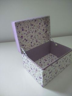 a purple and white box sitting on top of a table