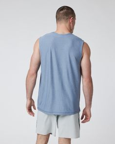 The softest piece of workout gear on the planet gets a new life in this breezy muscle tank. Fully functional and endlessly comfortable, you'll wear this tank all summer long. | Vuori Strato Muscle T-Shirt / Tee | Chambray Heather | XL Vuori makes premium performance apparel inspired by the active Coastal California lifestyle; an integration of fitness, surf, sport, and art. Breaking down the boundaries of traditional activewear, we are a new perspective on performance apparel. Summer Athleisure T-shirt For Gym, Cotton Sleeveless Muscle Tee For Athleisure, Cotton Sleeveless Athleisure Muscle Tee, Sporty Sleeveless Muscle Tee With Relaxed Fit, Sporty Sleeveless Relaxed Fit Muscle Tee, Relaxed Fit Muscle Tee Tank For Athleisure, Relaxed Fit Muscle Tee Tank In Athleisure Style, Summer Go-dry Crew Neck Muscle Tee, Sporty Relaxed Fit Sleeveless Muscle Tee