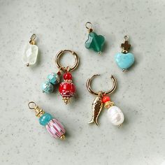 Choose your favorite combination of these fun charms. You can easily hang them on the stainless steel gold earrings with a handy click system. Have fun!




 Material: stainless steel with different types of gemstones including peridot, jade, trukkois, freshwater pearl and bamboo coral with 14K gold plated E-coating




 The price is per piece and excluding earring (you must order these separately). Combi Van, Charms Earrings, Bamboo Coral, Earring Charms, Types Of Gemstones, Fun Earrings, Arm Candy, Charm Earrings, Have Fun