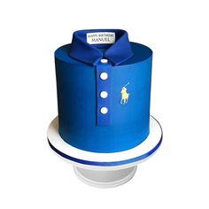 a blue cake with a polo shirt on it's top and white trims