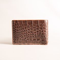 "Using only the finest quality leather, this handmade product will provide you with the perfect matching accessory for any occasion. Please follow the link to take a look at all other beautiful products in my store: https://www.etsy.com/shop/Tocroco ✦THE REASONS WHY YOU SHOULD CHOOSE MY PRODUCT - Clear product origin, no ambiguity. - Genuine farmed alligator leather, best quality skin for ultimate touch feel, long-lasting experience. - Proudly handcrafted from start to finish, handmade with care Leather Wallet With Crocodile Pattern, Leather Bifold Card Holder With Crocodile Pattern, Business Leather Card Holder With Crocodile Pattern, Leather Bifold Wallet With Crocodile Pattern, Leather Wallet With Crocodile Pattern For Daily Use, Classic Leather Card Holder With Crocodile Pattern, Daily Use Leather Wallet With Crocodile Pattern, Classic Crocodile Pattern Leather Card Holder, Luxury Brown Trifold Rectangular Wallet