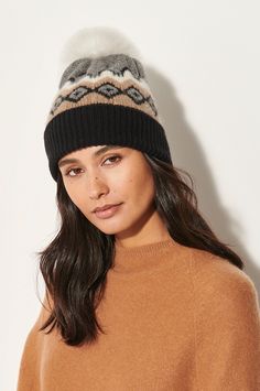 When cold comes calling, snuggle into the striking Nordic Knit Cashmere hat. Soft 100% cashmere yarns deliver wonderful warmth, while a generous and adjustable ribbed brim offers that perfect fit. Featuring a multicolor jacquard design, this super charming style is topped with a detachable fox pom for a pop of cloud-like softness that brings a smile. Complete your alpine-ready look with the matching cashmere mittens. Winter Knitted Cashmere Hat, Winter Cashmere Knitted Hat, Cashmere Hat For Winter Cold Weather, Winter Cashmere Hat For Cold Weather, Cozy Cashmere Winter Hat, Cashmere Hat, Promo Gifts, Sheepskin Slippers, Jacquard Design