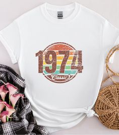 Retro 1974 Tshirt, Trendy Birthday Shirt, 50th Birthday Gift For Women Men, Vintage 1974 Shirt,1974 Classic Tee 50th Birthday Party Tshirts HOW TO ORDER 1-) Please, check and review all photos 2-) Choose your item size and color 3-) Click add to cart. You can go back to add more product 4-)Click "Proceed to check out" 5-)When you check out, you can add a note to seller for any request PRODUCT FEATURE It's a 50% Cotton /50% polyester, 13.5oz fleece. It features a double-needle collar, shoulders, Vintage White T-shirt For Birthday, Retro White T-shirt For Birthday, Retro White Tops For Anniversary, 50th Birthday Gifts For Woman, Birthday Gift For Women, 50th Birthday Gifts, 50th Birthday Party, Men Vintage, Birthday Gifts For Women