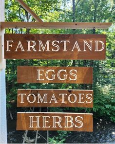 a wooden sign that says farms and eggs tomatoes herbs