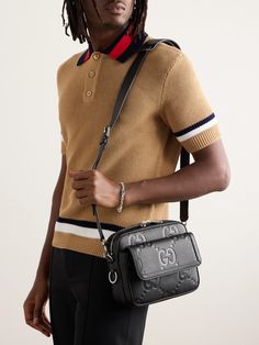 Gucci's messenger bag is debossed with the label's 'GG' motif, blown up to 'Jumbo' proportions. It's been made in Italy from full-grain leather and has a sizable flap pocket that's ideal for your phone or cards. Gucci Messenger Bags, Tom Ford Bag, Luxury Sneakers, Wardrobe Edit, Messenger Bag Men, Leather Messenger Bag, Gucci Men, Leather Messenger, Stylish Watches