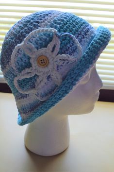 This crochet bucket style hat with interchangeable flower is handmade with 100% cotton yarn. -The hat's color is various shades of blue  -This crochet womens sun hat is made to fit a teen or adult head circumference -Make a fashion statement while keeping your head cool and protected when wearing this handmade cotton sun hat as a stylish crochet beach hat! Cheap Blue Summer Hats, Affordable Blue Summer Hats, Cheap Blue Summer Sun Hat, Playful Blue Affordable Sun Hat, Cheap Blue Sun Hat For The Beach, Cheap Blue Hats For Beach Season, Cheap Blue Hats For Vacation, Cheap Blue Vacation Hats, Cheap Blue Crochet Cap