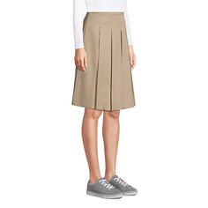 Classic pleats in our easy-care blend fabric that resists stains, wrinkles and fading so she looks good all school day long. Top-of-knee length. Classic Cotton Pleated Waist Skirt, Classic Cotton Pleated Skirt With Accordion Pleats, Pleated Cotton Skort For Work, Short Cotton Pleated Skirt In Solid Color, Preppy Cotton Skirt For Workwear, Classic Cotton Pleated Lined Skirt, Classic Cotton Skort For Spring, Classic Cotton Lined Skort, Classic Cotton Skort With Lined Skirt