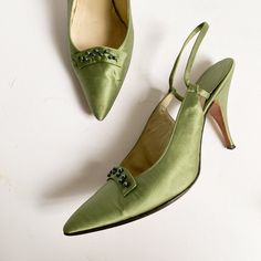 Vintage 1960s Freedom Shoes pumps in a gorgeous shade of green satin (feels like silk) embellished with irridescent beaded curved panels at the toes and an elegant narrow slingback strap. Uppers have some creasing and blemishes in areas as shown. Some wear to soles; I do not think these were worn much as the silk at the heel part of the insole is so smooth and clean. No size listed; I am a 7-7.5 and I can slip them on but they are snug; please compare with a pair of your own shoes for reference. 9 7/8" along insole from toe to heel, 2 7/8" across ball of foot, 3.5" heel height. Vintage Almond Toe Green Heels, Vintage Green Almond Toe Heels, Retro Green Heels For Evening, Vintage Green Heels For Formal Occasion, Elegant Green Heels For Evening, Elegant Green Evening Heels, Vintage Green Heels, Vintage Slingback Heels For Evening, Vintage Slingback Heels For Party