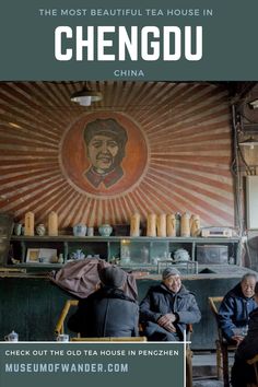 people sitting at a table in front of a wall with an image of chengdu on it