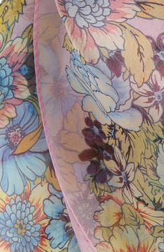 The pastel-hued flowers printed on sheer silk form dimensional bouquets as you wrap, layer or tie this rectangular scarf. 53" length, 33" width 100% silk Dry clean Made in Italy Silk Scarves With Floral Print For Spring, Pink Floral Print Silk Scarf, Pink Floral Print Feminine Scarves, Pink Feminine Floral Print Scarves, Feminine Pink Floral Print Scarves, Pink Silk Scarf With Floral Print, Pink Floral Print Silk Scarves, Silk Scarf With Floral Print For Wedding, Spring Flower Silk Scarf