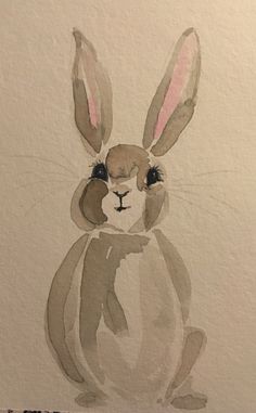 a watercolor painting of a rabbit with big ears