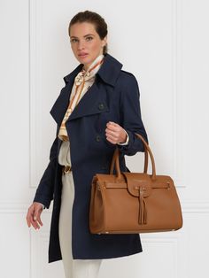 Where has the Windsor been all your life? Available in an array of shades, our iconic Windsor is one you can sling over your shoulder or slide onto your arm to put the finishing touch on any outfit. Take this beautifully betasseled bag from meetings to meet-ups and look perfectly pulled together, 12 months of the year. One large compartment: all the room you need for the day’s essentials – even your laptop Leather exterior: luxurious suede meets pebbled leather side panelling Microfibre lining: Textured Leather Travel Bags For Fall, Fall Travel Bags In Textured Leather, Fall Office Bag In Textured Leather, Fall Office Bags In Textured Leather, Timeless Shoulder Bag For Travel In Fall, Timeless Fall Travel Bags, Luxury Cognac Shoulder Bag For Fall, Cognac Textured Leather Workwear Bags, Textured Saffiano Leather Shoulder Bag For Travel