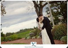 a bride and groom pose for a wedding photo