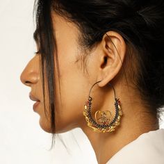 The Aria Athena Hoops feature a Greek fusion of design with Indian traditional jewelry elements in a modern hoop fashion. The two-toned plating allows for a versatile styling idea. Gifting: This choker set comes in a beautiful Yamoona gift box, making it an ideal gift for birthday, wedding anniversary or wedding gift. Occasion: Perfect choice for any Indian occasion, festivals, parties, dances, and weddings Care: We recommend you protect your silver jewellery and increase the longetivity of the plating by placing the jewelry in a fabric pouch and storing it in a cool, dry place, keeping individual pieces separate to avoid scratching. Also to maintain the best condition of your jewellery remove when showering, swimming or when undertaking manual or domestic work. Free Shipping on Orders ove Bohemian Hoop Earrings For Celebrations, Festive Elegant Hoop Jewelry, Bohemian Hoop Earrings For Wedding, Temple Jewelry Style Hoop Earrings For Celebration, Festive Fusion Style Hoop Earrings, Festive Fusion Hoop Earrings, Celebration Chandbalis, Oxidized Finish Chandbali Hoop Earrings, Elegant Oxidized Hoop Earrings For Wedding