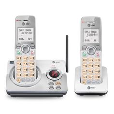 two cordless phones sitting side by side on top of each other in front of a white background