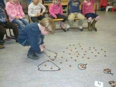 a group of children sitting around playing with toys