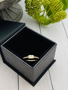 This beautiful and dainty baguette ring is available in thick and durable rhodium plated .925 sterling silver or 14K gold plated .925 sterling silver. The CZ stone is approximately 4x6mm. The natural ashes will be set behind the stone so the stone color may vary depending on the ash color showing through. Mailing instructions for your ashes can be found on the main page of the website. Please mail them to me ASAP. You can order a prepaid shipping kit if you would like, but it is not required. White Gold Cubic Zirconia Midi Rings As Gift, Diamond Stackable Midi Rings As Gift, Minimalist Cubic Zirconia Crystal Ring Gift, Fine Jewelry Stackable Princess Cut Promise Rings, Classic Cubic Zirconia Midi Rings For Gift, Fine Jewelry Princess Cut Stackable Promise Rings, Classic Sterling Silver Rings With Baguette Diamonds, Princess Cut Diamond Stackable Rings For Gift, Princess Cut Diamond Stackable Rings As Gift