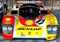 the front end of a race car with shell logo on it