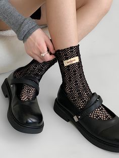 Elevate your summer style with these milk-white/black summer hollow-out socks. Made from high-quality, breathable material, these socks are perfect for adding a touch of elegance to any outfit. The hollow-out design adds a playful and feminine touch, making these socks a versatile accessory for both Lolita and Kawaii fashion enthusiasts.   Please note that this product includes only one pair of socks. Frilly Socks With Docs, Lacey Socks Aesthetic, Lace Socks Black, Black Harajuku Socks For Spring, Black Fitted Harajuku Socks, Steampunk Fashion Male, Gothic Skirts, Lace Socks, Steampunk Accessories